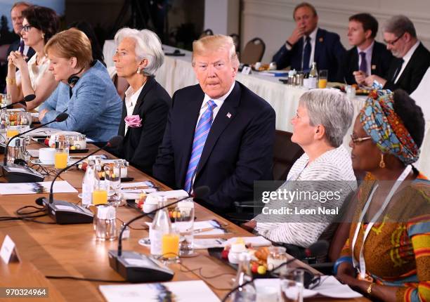 European Union Council President Donald Tusk, Dayle Haddon, Christine Lagarde, US President Donald Trump, Christine Whitecross and Winnie Byanyima...