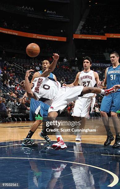 Jeff Teague of the Atlanta Hawks suffers a flagrant foul by Wayne Ellington of the Minnesota Timberwolves on February 24, 2010 at Philips Arena in...