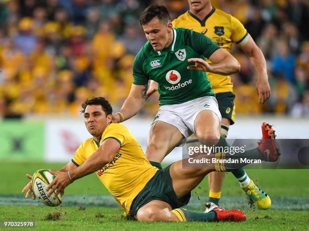 Brisbane , Australia - 9 June 2018; Nick Phipps of Australia in action against Jacob Stockdale of Ireland during the 2018 Mitsubishi Estate Ireland...