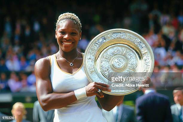 Wimbledon Ladies champion Serena Williams of the USA poses with the winning trophy at the Wimbledon Lawn Tennis Championship held at the All England...