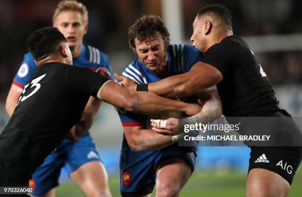 France Maxime Medard is tackled by New Zealand Anton Lienert-Brown and Ngani Laumape during the first rugby Test match between New Zealand and France...