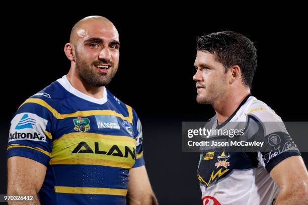 Tim Mannah of the Eels talks to Lachlan Coote of the Cowboys during the round 14 NRL match between the Parramatta Eels and the North Queensland...