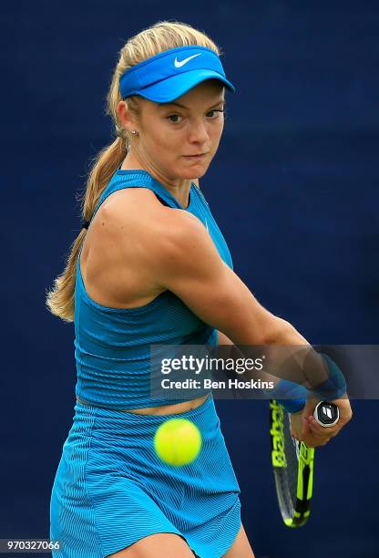 Katie Swan of Great Britain hits a backhand during her qualifying match against Abigail Tere-Apisah of Papua New Guinea on Day One of the Nature...