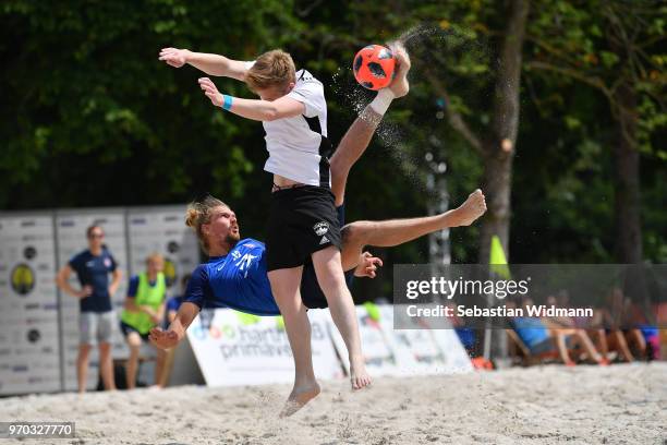 Player of Wuppertaler SV Beachsoccer does a bicycle kick during Day 2 of the German Beachsoccer League at Munich Beach Resort on June 9, 2018 in...