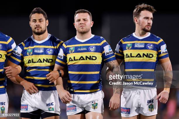 Jarryd Hayne, Nathan Brown and Clint Gutherson of the Eels look on during the round 14 NRL match between the Parramatta Eels and the North Queensland...