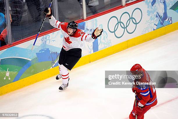 Corey Perry of Canada celebrates after a goal as Sergey Fedorov of Russia during the ice hockey men's quarter final game between Russia and Canada on...