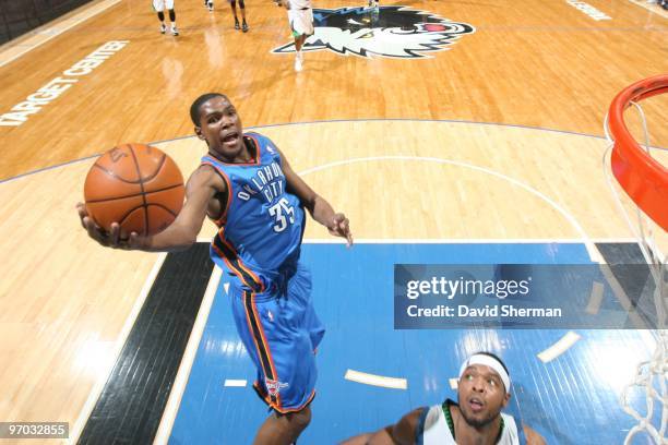 Kevin Durant of the Oklahoma City Thunder shoots a layup against Ryan Gomes of the Minnesota Timberwolves during the game at Target Center on...