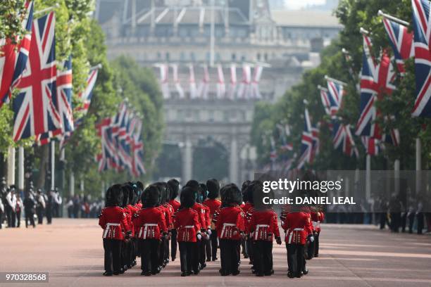 Members of the Household Division, march down The Mall to Horseguards parade ahead of the Queen's Birthday Parade, 'Trooping the Colour', in London...