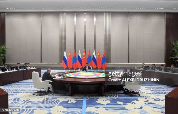 Russian President Vladimir Putin , Chinese President Xi Jinping and Mongolian President Khaltmaa Battulga hold a trilateral meeting on the sidelines...