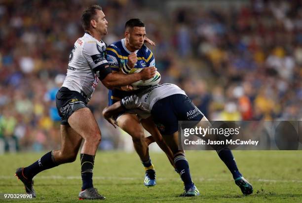 Corey Norman of the Eels is tackled Kane Linnett of the Cowboys during the round 14 NRL match between the Parramatta Eels and the North Queensland...