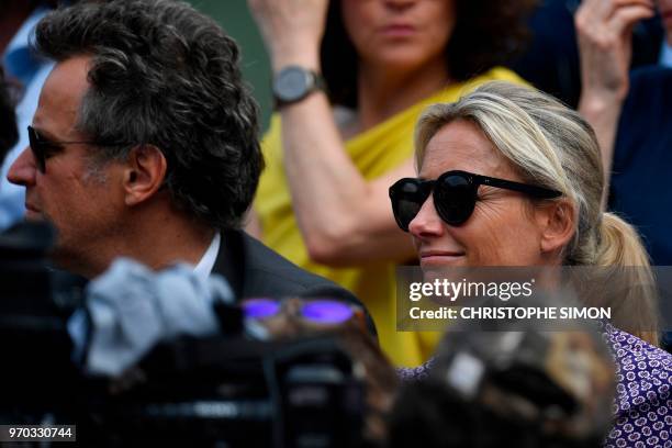 Spectators including French journalist Anne-Sophie Lapix look on as The Suzanne-Lenglen Cup arrives ahead of the women's singles final match between...