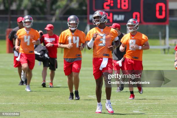 Jameis Winston leads the group of quarterbacks to the next drill as Ryan Griffin , Ryan Fitzpatrick and Austin Allen follow during the Tampa Bay...