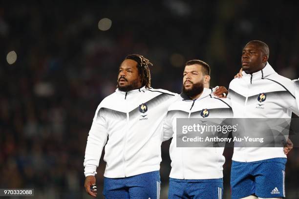 Mathieu Bastereaud, Rabah Slimani and Judicael Cancoriet of France stand for the national anthem during the International Test match between the New...