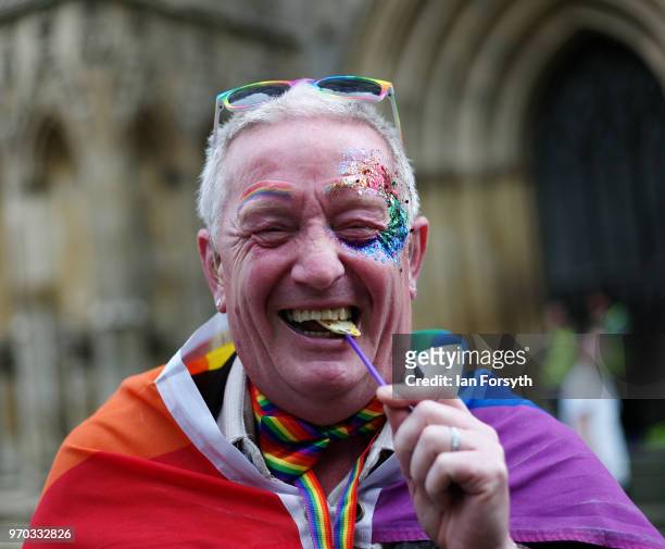 Man reacts to the camera as he attends the York Pride parade on June 9, 2018 in York, England. The parade made its way through the streets of the...