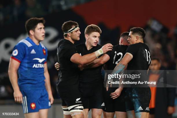 Anton Lienert-Brown of the All Blacks celebrates with teammates Beauden Barrett and Luke Whitelock after scoring a try during the International Test...