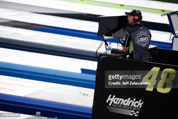 Chad Knaus, crew chief for Jimmie Johnson, driver of the Lowe's for Pros Chevrolet, watches from the top of the hauler during practice for the...