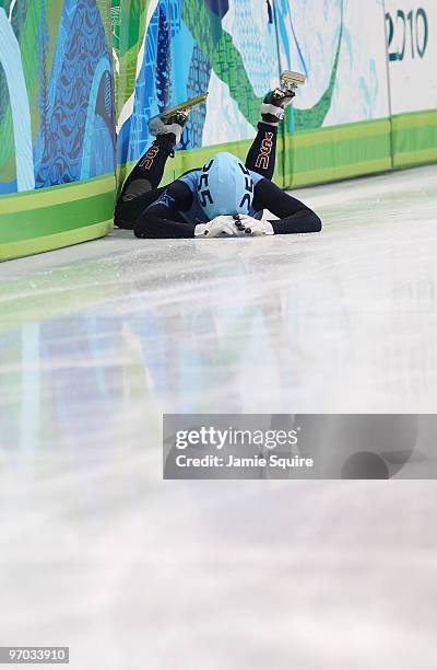 Jordan Malone of the United States falls during the Short Track Speed Skating Men's 500m heat on day 13 of the 2010 Vancouver Winter Olympics at...