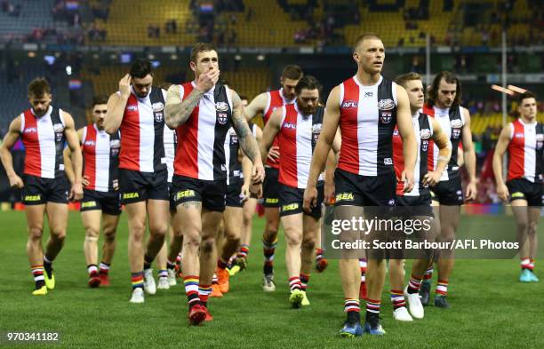 Sebastian Ross of the Saints and his teammates leave the field after losingd the round 12 AFL match between the St Kilda Saints and the Sydney Swans...