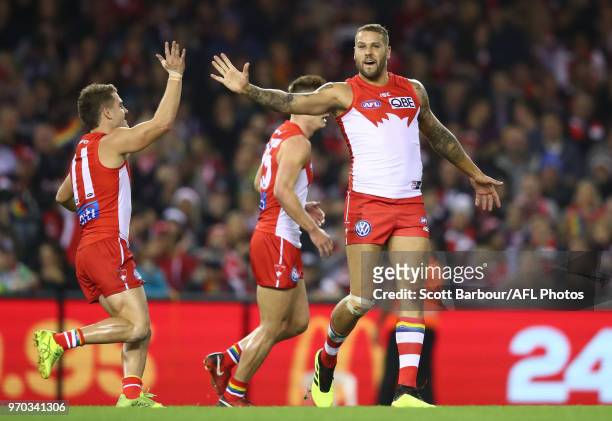 Lance Franklin of the Swans celebrates after kicking a goal with Tom Papley of the Swans during the round 12 AFL match between the St Kilda Saints...