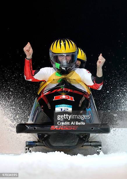 Fabienne Meyer Hanne Schenk of Switzerland celebrate in Switzerland 2 after completing their fourth run during the womens bobsleigh on day 13 of the...