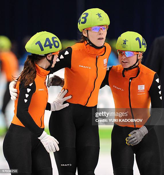 Netherlands's Maaike Vos, Jorien ter Mors and Sanne van Kerkhof react after their Women's Short Track Speedskating 3000m Relay final, at the Pacific...