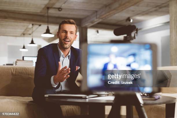 businessman recording a video for this vlog - filming stock pictures, royalty-free photos & images