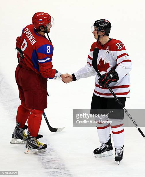 Alexander Ovechkin of Russia shakes hands with Sidney Crosby of Canada after Canada's 7-3 victory during the ice hockey men's quarter final game...