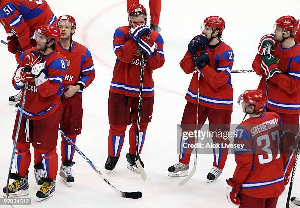 Alexander Ovechkin of Russia and Team Russia stands on the ice after losing to Team Canada 7-3 during the ice hockey men's quarter final game between...