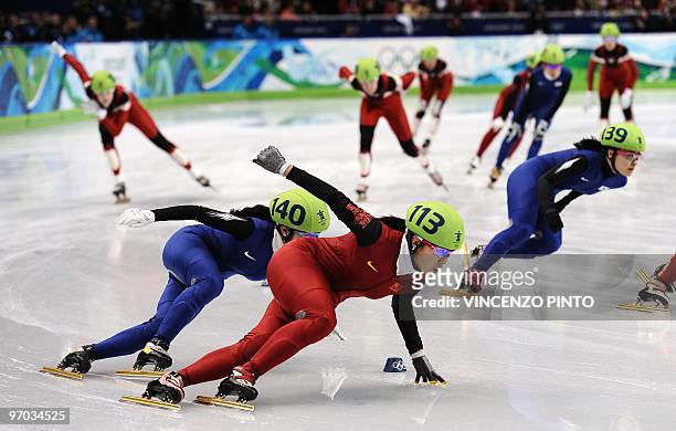 South Korea's Lee Eun-Byul chases China's Zhang Hui in the Women's Short Track Speedskating 3000m Relay finals, at the Pacific Coliseum in Vancouver,...