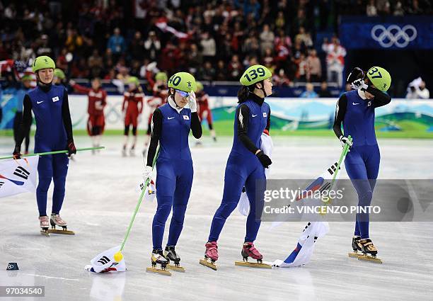 South Korean skaters Park Seung-Hi, Lee Eun-Byul, Kim Min-Jung and Cho Ha-Ri react after being disqualified in the Women's Short Track Speedskating...