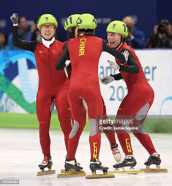 Zhang Hui, Sun Linlin, Wang Meng and Zhou Yang of China celebrate winning the gold medal in the Short Track Speed Skating Ladies' 3000m relay finals...