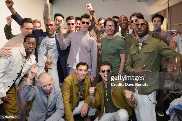 Designer Oliver Spencer poses with models backstage at the Oliver Spencer Catwalk Show SS 2019 during London Fashion Week Men's June 2018 at 180 The...