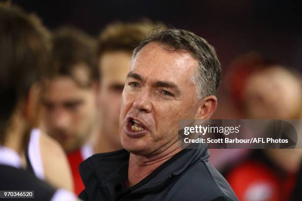 Alan Richardson, coach of the Saints speaks to his team during a quarter time break during the round 12 AFL match between the St Kilda Saints and the...