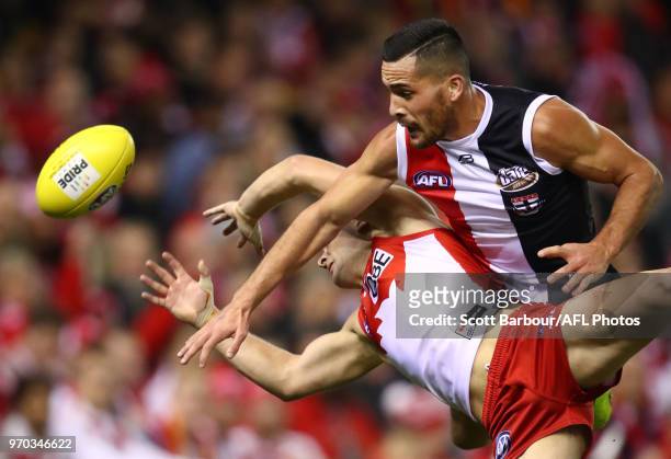 Tom Papley of the Swans and Shane Savage of the Saints compete for the ball during the round 12 AFL match between the St Kilda Saints and the Sydney...