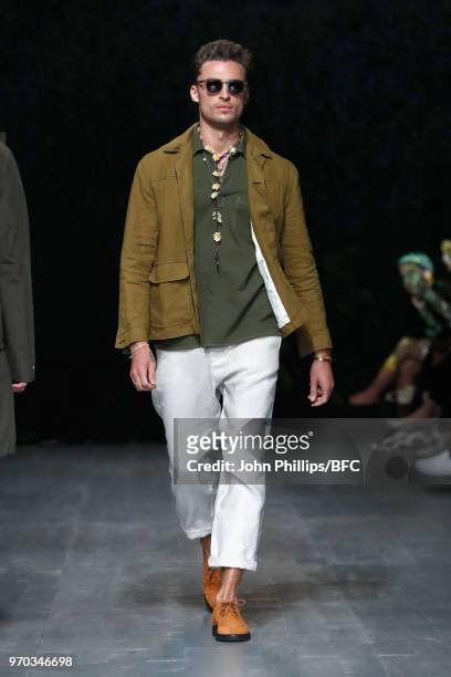 Model walks the runway at the Oliver Spencer show during London Fashion Week Men's June 2018 at BFC Show Space on June 9, 2018 in London, England.