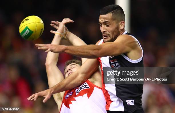 Tom Papley of the Swans and Shane Savage of the Saints compete for the ball during the round 12 AFL match between the St Kilda Saints and the Sydney...