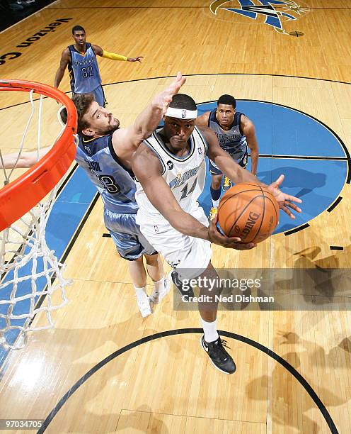 Al Thornton of the Washington Wizards shoots against Marc Gasol of the Memphis Grizzlies at the Verizon Center on February 24, 2010 in Washington,...