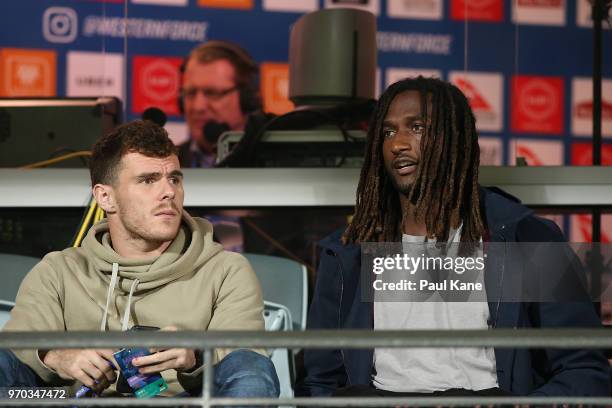 Luke Shuey and Nic Naitanui of the West Coast Eagles look on from the stands during the World Series Rugby match between the Force and the Rebels at...