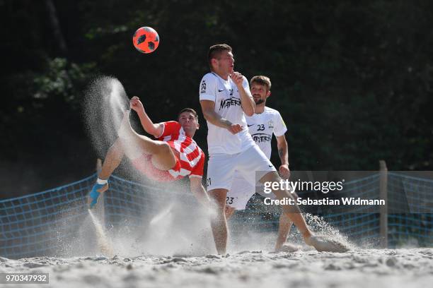 Player of Rostocker Robben does a bicycle kick during Day 2 of the German Beachsoccer League during Day 2 of the German Beachsoccer League at Munich...