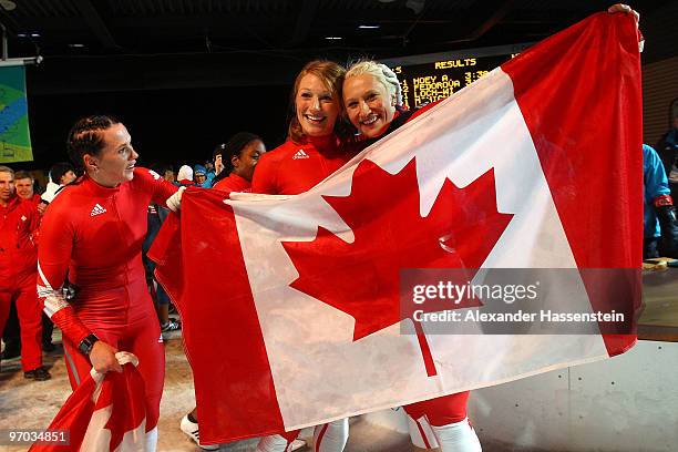 Heather Moyse and Kaillie Humphries of Canada celebrate winning gold during the women's bobsleigh on day 13 of the 2010 Vancouver Winter Olympics at...