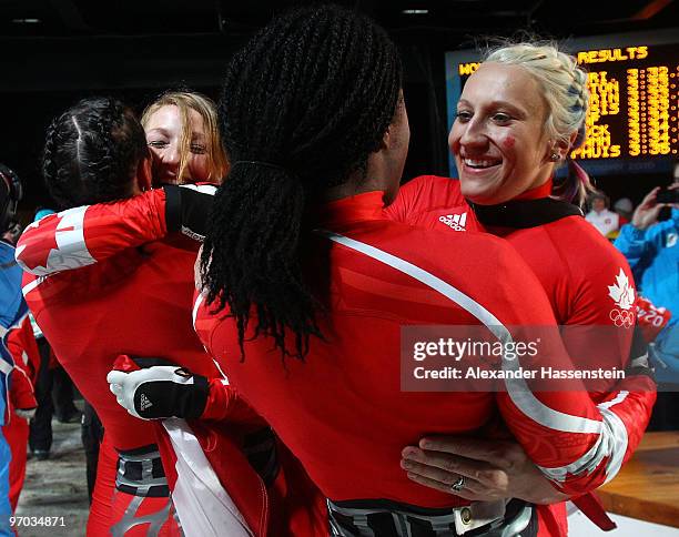 Shelly-Ann Brown of Canada 2 congratulates Kaillie Humphries of Canada 1 after the women's bobsleigh on day 13 of the 2010 Vancouver Winter Olympics...