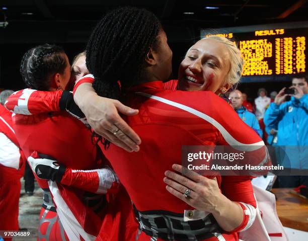 Shelly-Ann Brown of Canada 2 congratulates Kaillie Humphries of Canada 1 after the women's bobsleigh on day 13 of the 2010 Vancouver Winter Olympics...