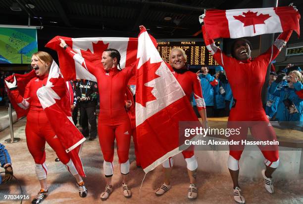 Heather Moyse and Kaillie Humphries of Canada 1 celebrate gold and Helen Upperton and Shelly-Ann Brown of Canada 2 celebrate silver after the women's...