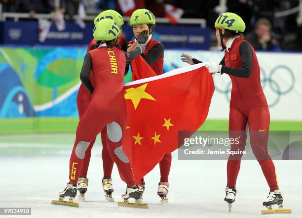 Sun Linlin, Wang Meng, Zhou Yang, Zhang Hui and Wang Meng of Team China celebrate winning the gold medal in the Short Track Speed Skating Ladies'...