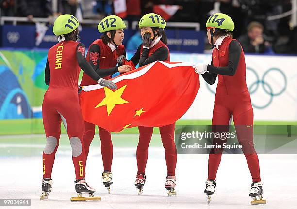 Sun Linlin, Wang Meng, Zhou Yang, Zhang Hui and Wang Meng of Team China celebrate winning the gold medal in the Short Track Speed Skating Ladies'...