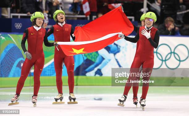 Sun Linlin, Wang Meng, Zhou Yang, Zhang Hui and Wang Meng of Team China celebrate winning the gold medal in the Short Track Speed Skating Ladies'...