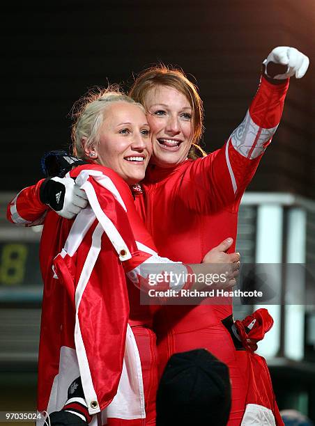 Heather Moyse and Kaillie Humphries of Canada celebrate winning gold during the women's bobsleigh on day 13 of the 2010 Vancouver Winter Olympics at...