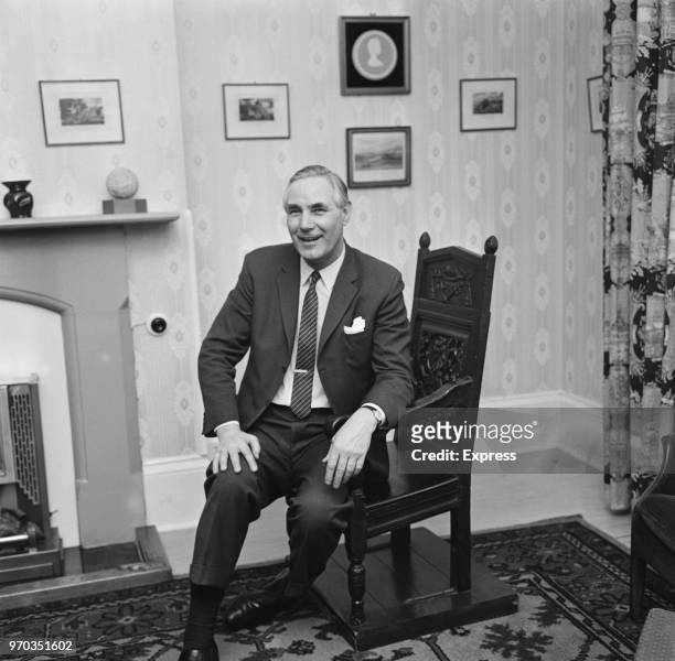 Former soccer player and manager of Bristol Rovers FC Bert Tann sitting on a wishing chair in the mayor of Weymouth's parlour, UK, 28th January 1967.