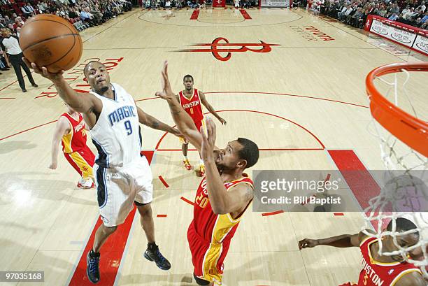 Rashard Lewis of the Orlando Magic shots the ball over Jared Jeffries of the Houston Rockets on February 24, 2010 at the Toyota Center in Houston,...