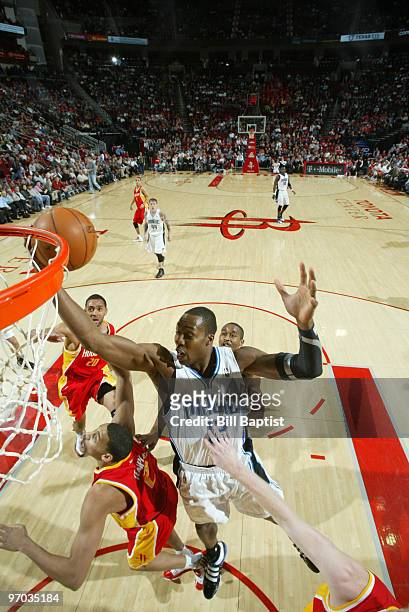 Dwight Howard of the Orlando Magic shoots the ball over Garrett Temple of the Houston Rockets on February 24, 2010 at the Toyota Center in Houston,...